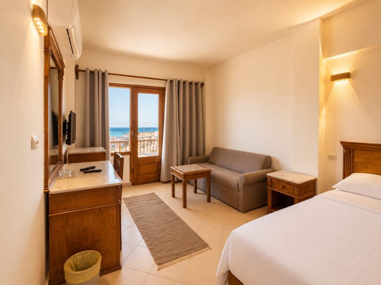 Spacious double sea view room with sofa, TV, desk, and balcony overlooking the Red Sea at Dyarna Hotel Dahab